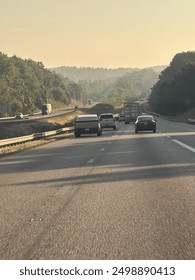 Tesla Cybertruck in traffic with blue ridge mountains in the distance.