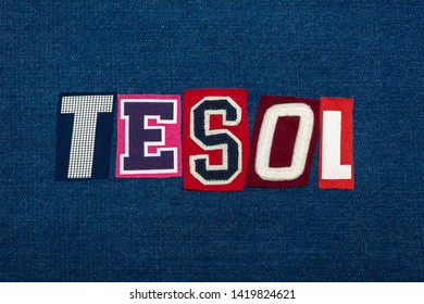 TESOL text word collage, multi colored fabric on blue denim, teach english to speakers of other languages acronym, horizontal aspect