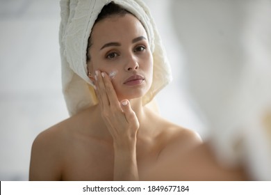 Test For Allergy. Careful Young Woman With Sensitive Skin Applying Small Spot Of Hypoallergenic Delicate Cream Lotion Serum Of Natural Organic Ingredients On Her Chick After Shower To Look At Result