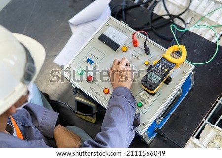 Test box for inject high voltage into electrical equipment for testing insulation resistance between electrical part with earth or grounding system. Selective focus.