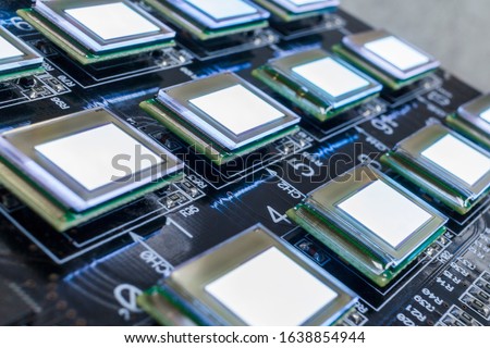 Test of checking several oled displays on the test station. Displays glow brightly of white color.Microelecronics.Display and light panel technology.