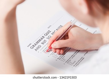 Test Of English Multiple Choice On Table. Woman Takes An Entrance Exam