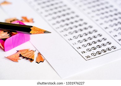 Test Exam Concept, Pencil Sharping By Sharpener Paper Answer Of Question In Examination Test. It Assessment Intended To Measure Knowledge, Skill, Aptitude, Physical Fitness, Or Classification Students