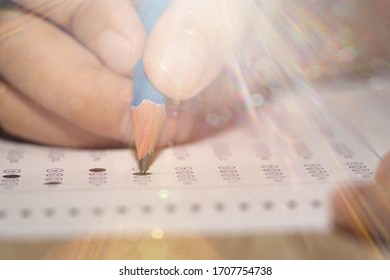 Test Exam Student, Pencil Writing Answer On Paper Answer Of Question In Examination Test. It Assessment Intended To Measure Knowledge, Skill, Aptitude, Physical Fitness, Or Classification Students