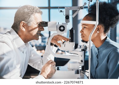 Test, eye exam or black woman consulting doctor for eyesight at optometrist or ophthalmologist. African customer testing vision with mature optician helping or checking iris or retina visual health - Powered by Shutterstock