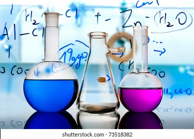 Test glass flask with solution in research laboratory. Science and medical background