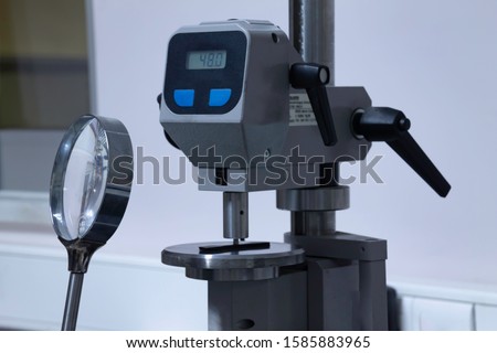 
test operator doing test in laboratory, rubber hardness test
