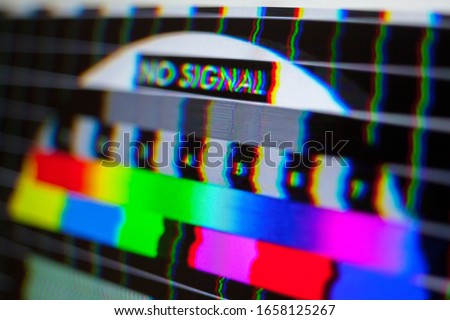 Test pattern on the screen. Glitch. Digital errors. No signal.