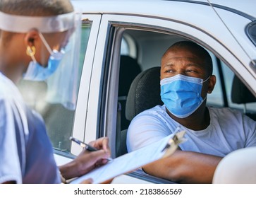 Test, Questions And Screening At A Covid Drive Thru Checkpoint. A Man Traveling In A Car Talking To A Healthcare Professional Writing His Coronavirus Details While Wearing A Face Mask