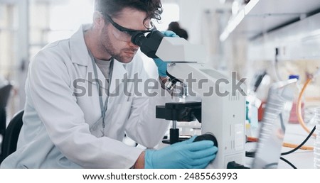 Test, research and man with microscope, science and check experiment for cancer treatment. Person, scientist and employee with lab equipment, biotech and cure development with sample and studying