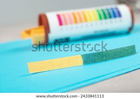 test strip with water sample, water PH testing