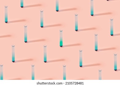 Test Tubes With Blue Liquid On A Pastel Pink Background. Bio Weapons Minimal Pattern.