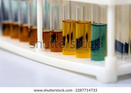Test tubes with multi-colored reagent analysis. Colorimetry expe