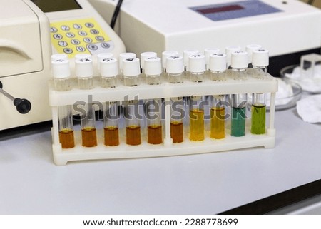 Test tubes with multi-colored reagent analysis. Colorimetry expe