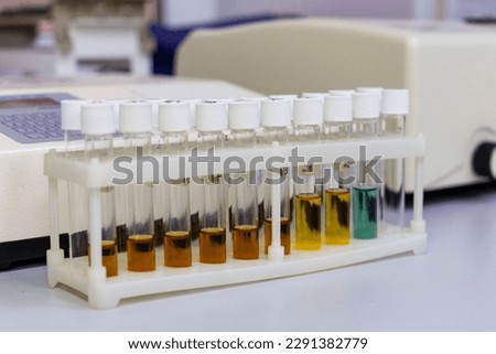 Test tubes with multi-colored reagent analysis. Colorimetry expe