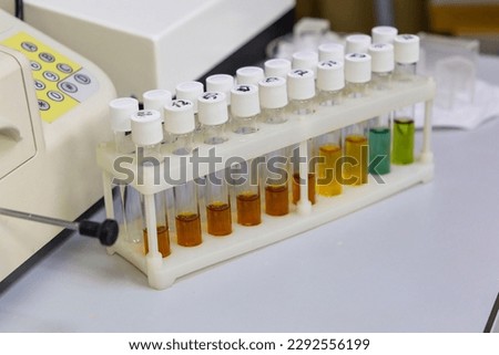 Test tubes with multi-colored reagent analysis. Colorimetry expe