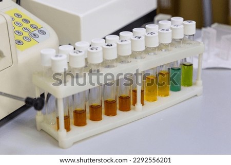 Test tubes with multi-colored reagent analysis. Colorimetry expe