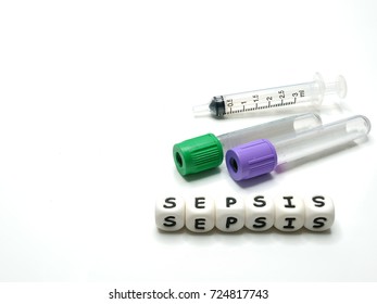 Test Tubes And Syringe For Taking Blood Samples For Diagnostic Examination In Sepsis Condition, And Silicone Letters Spelling The Word 