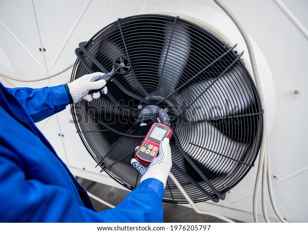 Testing with an anemometer of an axial fan of the\
condensing unit