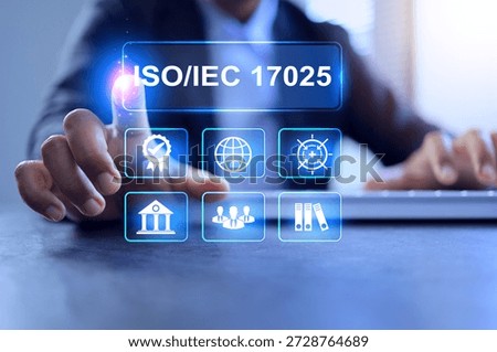 Testing and calibration laboratory management system or ISO IEC 17025 concept with businessman working on desktop to implement work methods compliance regulation and standards requirement