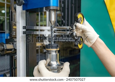 Testing and checking cutting tools for runout on a stand in the centers using indicators.