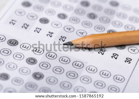 testing in exercise and exam paper. computer sheet with pencil in school test room, education concept