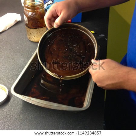 Testing Oil Sample in a Sieve Pan