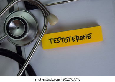Testoterone write on sticky notes isolated on Wooden Table.