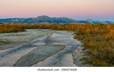 The Teton River With Ear Mountain In Autumn At Sunrise Near Choteau, Montana, USA