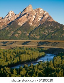The Tetons tower over the Snake river in Jackson Hole Wyoming.