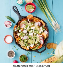 Tex Mex Skillet Nachos With Corn On Blue Wood Table Square