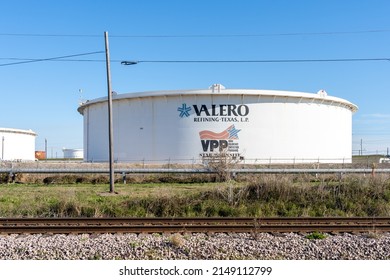 
Texas City, TX, USA - March 12, 2022: The Valero sign on the oil tank.  Valero Energy Corporation is a manufacturer and marketer of transportation fuels, other petrochemical products, and power.
