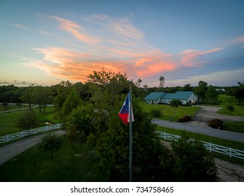 Texas Flag Flying High At Sunset	