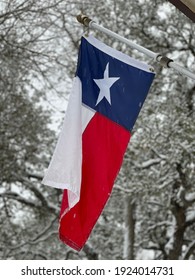 Texas flag hanging in winter scene