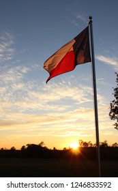 Texas Flag At Sunset