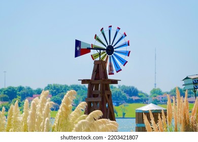 Texas flag windmill in the fall on a lake in Dallas Fort Worth Texas             