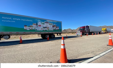 Texas USA - February 24,2020:  A line of trucks waiting at a USA border patrol checkpoint to be questioned.