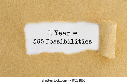 Text 1 Year 365 Possibilities appearing behind ripped brown paper - Shutterstock ID 739281862