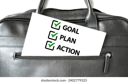 Text 2024 GOAL PLAN ACTION writing on white paper sheet in the black business bag. Business concept - Powered by Shutterstock