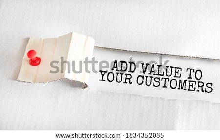 The text ADD VALUE TO YOUR CUSTOMERS appearing behind torn yellow paper