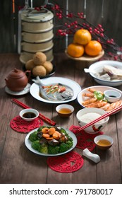 Text Appear In Image: Prosperity. Chinese New Year Food Homecooked Reunion Dinner On Wooden Table Top.