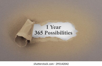 Text appearing behind torn brown envelop - 1 Year, 365 possibilities - Shutterstock ID 295142042
