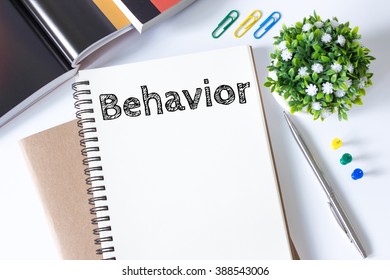 Text Behavior on white paper book and  office supplies on white desk / business concept - Shutterstock ID 388543006