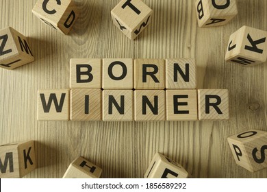 Text born winner from wooden blocks, success concept