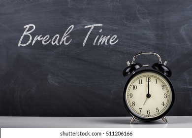  Text Break Time Handwritten With White Chalk On A Blackboard And Retro Alarm Clock