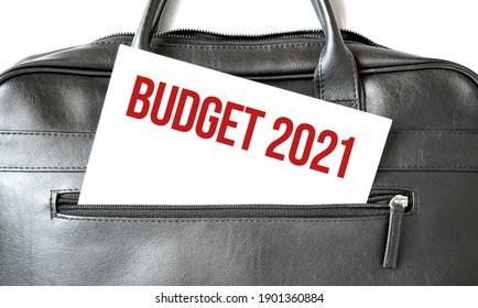 Text BUDGET 2021 Writing On White Paper Sheet In The Black Business Bag. Business Concept