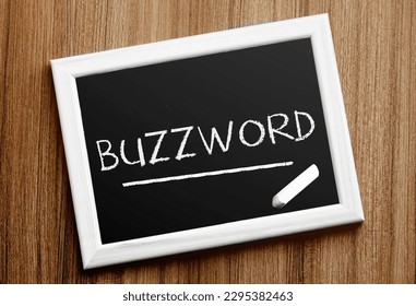 ?halkboard with text BUZZWORD on wooden background
