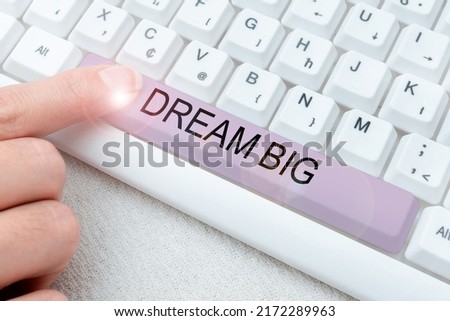 Text caption presenting Dream Big. Business overview To think of something high value that you want to achieve Colleagues Conencting Two Pieces Jigsaw Puzzle Together Showing Teamwork.