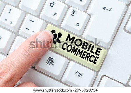 Text caption presenting Mobile Commerce. Business overview Using mobile phone to conduct commercial transactions online Transcribing Internet Meeting Audio Record, New Transcription Methods