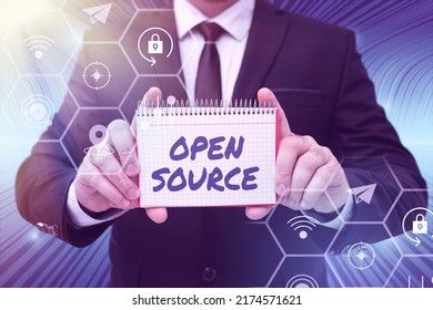 Text caption presenting Open Source. Word for denoting software which original source code freely available Businessman in suit holding notepad symbolizing successful teamwork.